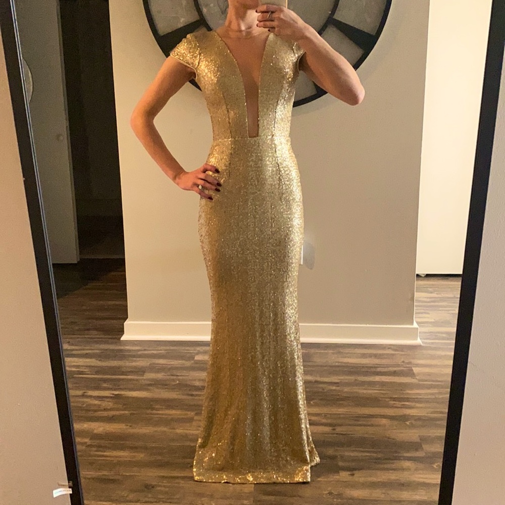 Gold gown with sheer detail. This is size XS-XXS. I’m 5’4”, 105 lbs.